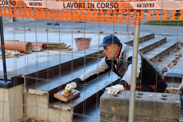 man pouring concrete